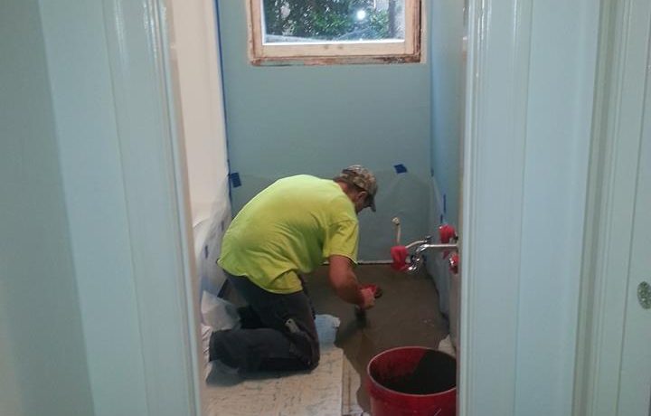 A skilled remodeler doing bathroom renovation particularly for the toilet area